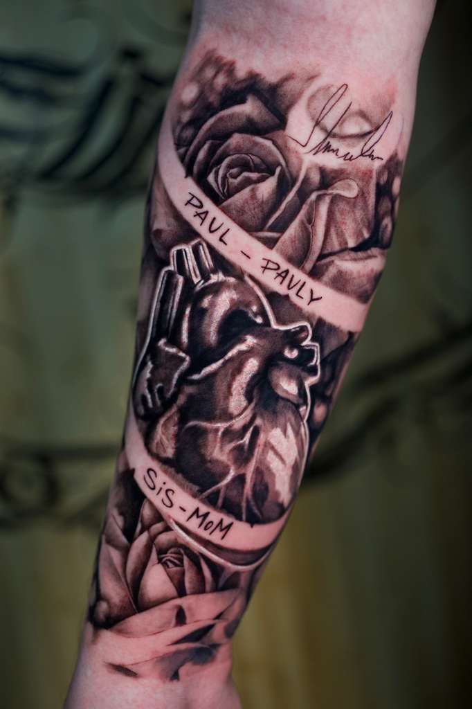 black and gray rose and skull forearm sleeve tattoo by Antwan Rodriguez, West Palm Beach FL